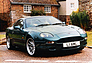 Aston Martin DB7 (1993) - vor passender Kulisse (© Archiv Automobil Revue) Aston Martin DB7 (1993) - vor passender Kulisse (© Archiv Automobil Revue)