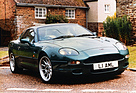 Image: Aston Martin DB7 (1993) - in front of a fitting backdrop