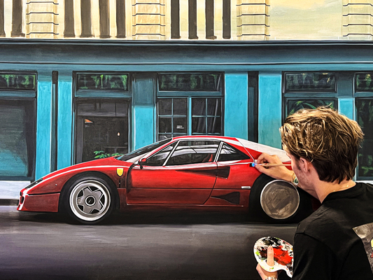 Auf dem Messestand in Aktion: Hendrik Schmeer malte während der Drei-Tage-Motorshow einen Ferrari F40 innerhalb einer ruhigen Straßenszene – meistens unter den Blicken neugieriger Zuschauer.