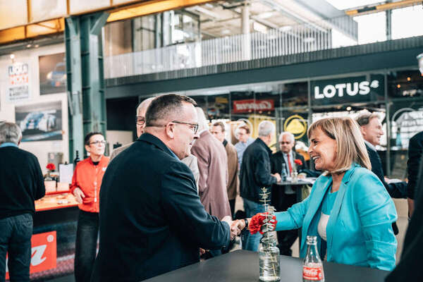 Image: Welcome at the bar table in front of the Lotus Store at Motorworld Munich