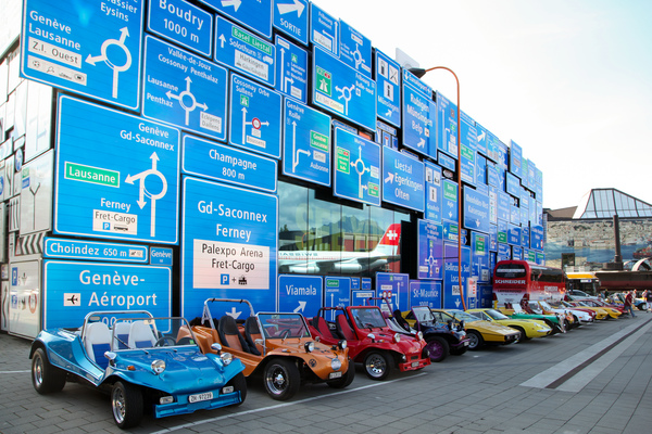 Image: Buggies and other plastic sports cars in front of the renovated road traffic hall of the Lucerne Museum of Transport - Fantastic Plastic 2017