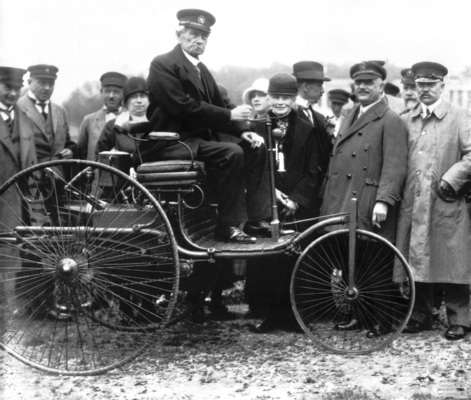 Carl Benz on his first patented Type I motor car from 1886, photographed in Munich in 1925.