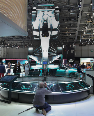 Daniel Reinhard photographs a Formula E car at the 2018 Geneva Motor Show