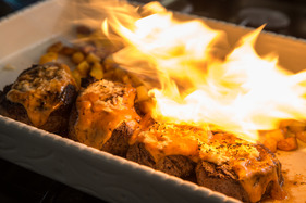 The meat is flambéed