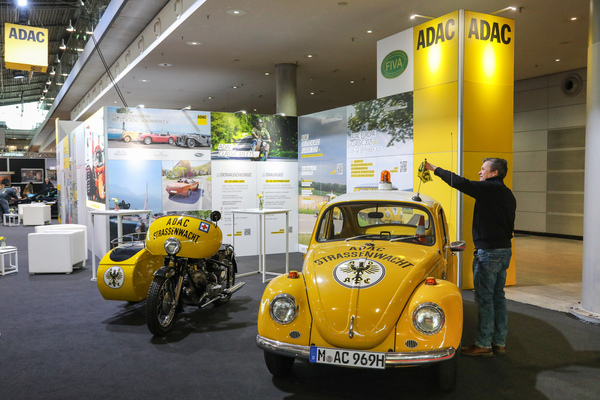 Image: The Strassenwacht Beetle next to a car and trailer at the ADAC stand in Hall 1 - 24 Retro Classics Stuttgart 2025