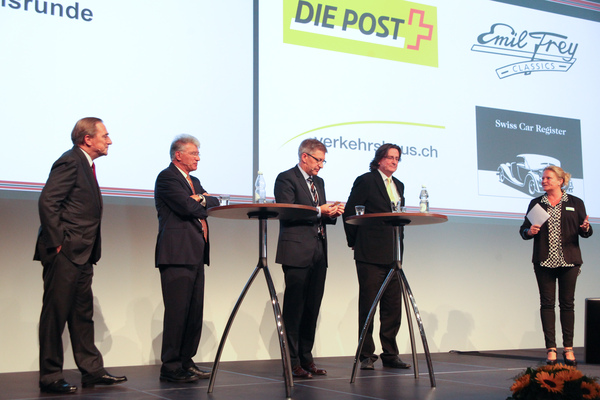 Image: The four guest speakers - Walter Frey, Urs P. Ramseier, Martin Bütikofer and Peter Hasler - launching the four Swiss stamps at the Emil Frey Classic Center