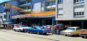 A flood of muscle cars in front of "the Brooklyn"