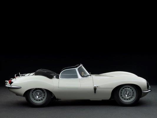 Image: One of only 16 Jaguar XKSSs built in 1957 - a racing car with soft top and luggage rack - on display at the Lukas Hüni stand at Rétromobile Paris 2016