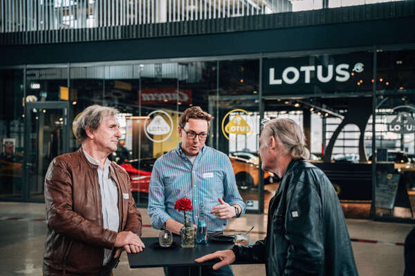 A professional discussion at the bar table in front of the Lotus Store