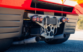 Ferrari 312 PB (1972) - Two exhaust gas nozzles, four tiny rear lights, transmission oil cooler in the impact area
