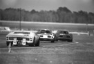 Ford GT 40 MKII (1966) in Daytona 1966 - Ford GT40 von Chris Amon hinter zwei Ferrari 250 LM von Hawkins und Hulme