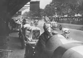 1926 German Grand Prix at Berlin's AVUS—the NSU 6:60 PS supercharged race cars are in the pits, waiting for the green light to start