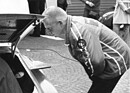 Image: Herbert Müller looks carefully under the hood of his Porsche 911