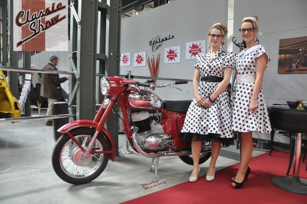 Image: Pretty girls on a motorcycle stand at the Classic Show in Brno