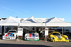 Image: Joest Porsche 935 J #7 (1980) in the paddock together with a Carrera RSR and 962 at the Porsche Rennsport Reunion V - raced in the DRM 1980 at the time