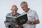 Josef and Daniel Reinhard looking at their new book "Inside Formula 1"