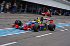 Bild: Larousse-Lola Ford (1988) an der Bosch Hockenheim Historic 2021 - Ein Mitglied des Raceclub Germany in der Boxengasse.