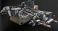 Lola T260 (1971) - Schön verarbeitete Technik an der Vorderradaufhängung mit grossen Seitenkühlern, Umlenk-Rohrpyramide zu hoch liegenden Federbeinen(vgl. Hinterradaufhängung Ferrari B2 1971 TiR 31) (© Archiv: Gerhard Schütz, 2023) Lola T260 (1971) - Schön verarbeitete Technik an der Vorderradaufhängung mit grossen Seitenkühlern, Umlenk-Rohrpyramide zu hoch liegenden Federbeinen(vgl. Hinterradaufhängung Ferrari B2 1971 TiR 31) (© Archiv: Gerhard Schütz, 2023)