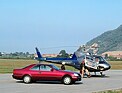 Image: Mercedes-Benz 500 SEC (1992) - This too must have happened often. The S-Class driver climbs into the helicopter