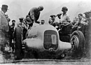 Image: Mercedes Benz W 25 (1934) - Klausenrennen winner Rudolf Caracciola with starting number 65 and track record