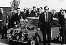 Image: Mini Cooper S (1964) - Paddy Hopkirk at the victory celebration after the Monte Carlo Rally