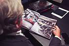 Image: Podcast "Alte Schule" episode 19 with René Staud - René Staud looks at one of his many works in book form