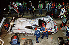 Image: Porsche 911 GT1 (1998) - Le Mans 1998: Winning car Porsche 911 GT1 '98 (No. 26), drivers: Allan McNish, Stéphane Ortelli and Laurent Aiello, in the background Norbert Singer.