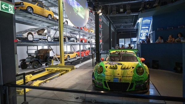 Image: Porsche 911 GT3 R (2018) — Retrieved from the shelf and placed on the revolving stage using a vehicle lift — the “Museums on Demand” concept was considered unique worldwide when the Autotheater opened in 2009 —