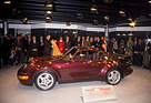 Image: Porsche 911 Turbo (Type 964) (1990) - Traditionally equipped with a widened body and large rear spoiler, the 911 Turbo, the third generation of the turbocharged 911, is presented at the 60th Geneva Motor Show