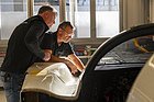 Image: Porsche 962 C (1987) - Armin Burger (left) and Traugott Brecht inspect the 962 C.