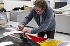 Image: Porsche 962 C (1987) - Rob Powell stickering the 962 C.