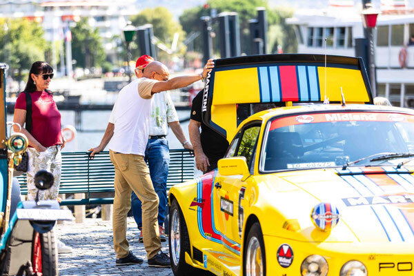 Image: Racing History You Can Touch—A Porsche 911 in Martini livery with a striking rear wing catches the eye of visitors