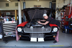 Sara from Sara's Garage on her Mustang