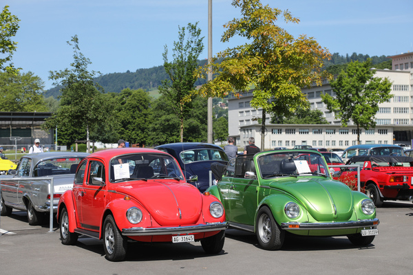 Image: VW Beetle in red and green on the classic car parking lot - Swiss Classic World 2025
