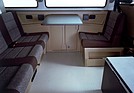 Image: VW T3 (1985) - The new interior concept of the Multivan offered a lounge feeling on wheels with the seats facing each other and the folding table.