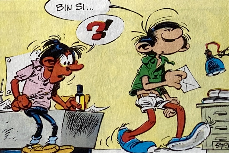 Gaston Lagaffe mit Urlaubsbräune an den Beinen und Kollege Lebrac